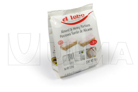 Conditionnement de morceaux de nougat en sachet à fond plat sur une ensacheuse verticale avec film laminé.